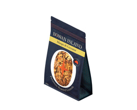 Bowan Island Premium Roasted Granola Mango & Coconut 650g – Crunchy granola with sweet mango pieces and coconut flakes, perfect for yoghurt, smoothie bowls, or cereal. Available at The Local Basket.