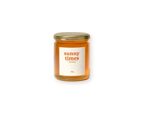 Sunny Times Raw Honey 380g jar - light, buttery honey with hints of floral citrus, preserving natural enzymes, pollen, and propolis, harvested from Tweed Valley, Queensland. Available at The Local Basket.