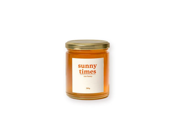 Sunny Times Raw Honey 380g jar - light, buttery honey with hints of floral citrus, preserving natural enzymes, pollen, and propolis, harvested from Tweed Valley, Queensland. Available at The Local Basket.